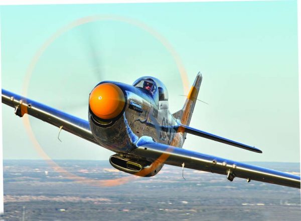 Ben Wilson points the nose of “The Brat III,” the Cavanaugh Flight Museum’s renowned P-51D at the camera. Wilson checked out in the Mustang, one of the only surviving P-51s with a combat history, in 2020. (Photo by Greg Morehead)