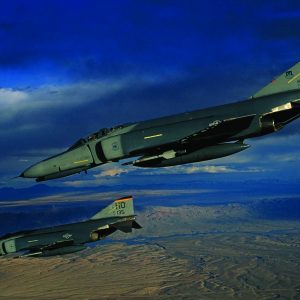 A pair of German-owned F-4F Phantom IIs fly over New Mexico during a training sortie. The German F-4Fs sported U.S. Air Force markings since they were based at Holloman AFB, New Mexico (for the better weather and ranges). Both U.S. and German instructors manned the unit, the 20th Fighter Squadron. (Photo by Ted Carlson/fotodynamics.com)
