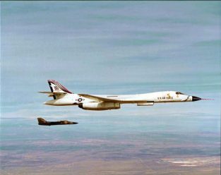 One of the four original B-1As pressed into service as a test aircraft for the B-1B program flies with an F-111 chase aircraft near Edwards AFB, California. (U.S. Air Force photo)