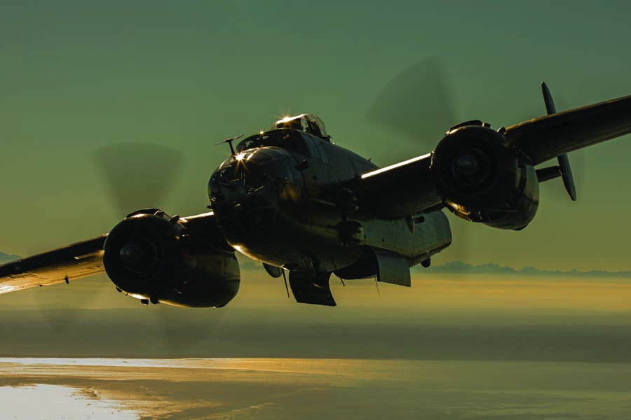 The Flying Heritage & Combat Armor Museum’s B-25J Mitchell swings right with bomb bays open and ready to strike near sunset. (Photo by John Dibbs/Facebook.com/theplanepicture)