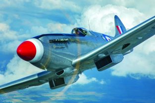 You can almost hear the Griffon growl as RAF BBMF pilot Sqn. Ldr. Andy Millikin brings Spitfire PR Mk XIX PS915 in close to the camera lens of John Dibbs. Note the scoop on the nose under the exhaust stubs, which was the air intake for the cockpit pressurization “blower” of these high-altitude versions. (Photo by John Dibbs/Facebook.com/theplanepicturecompany)