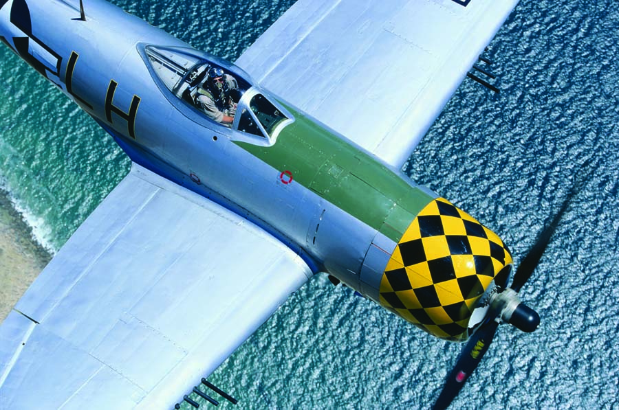 The later model bubble-canopy P-47s, with their up-powered radial engines, eight .50 caliber machine guns, eight rockets, and 2000-lb. bomb capacity, made a great platform for the lethal fighter-bomber role. The P-47 was the preferred mount of Squadron Leader Paul Douglas of the 368th FG. John Dibbs gets this amazing tight-in shot of an ETO Jug from above. (Photo by John Dibbs/Facebook.com/ theplanepicture)