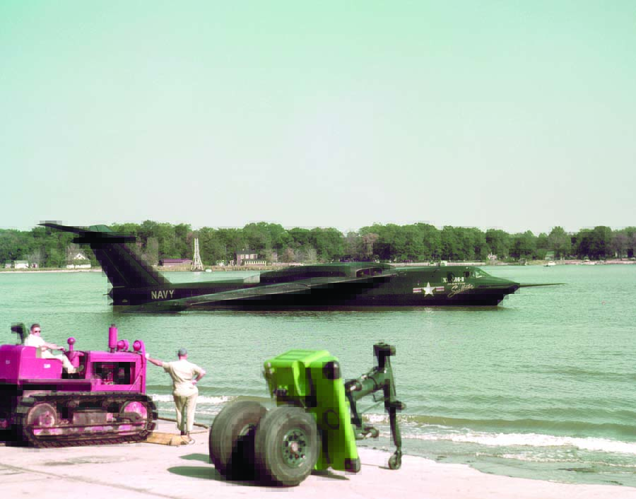 Ground crew from Martin’s Marine Division watch as Chief Pilot George Rodney maneuvers the first SeaMaster around Frog Mortar Creek. The wheels in the foreground are the old-fashioned, clip-on beaching gear.