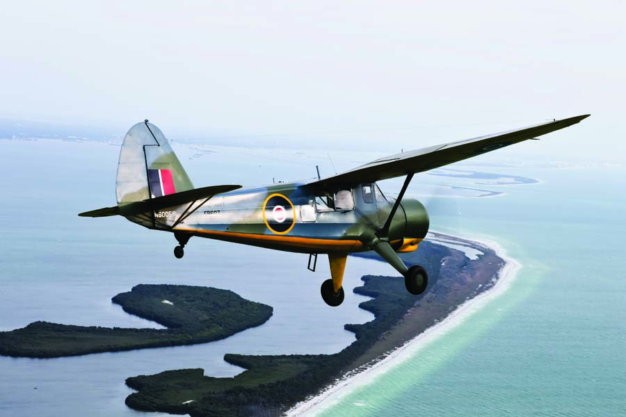 Tom Bullion flies over the Memphis, Tennessee landscape in his beautifully restored, military-variant Stinson AT-19. After serving in India with the RAF during WW II, this aircraft was later shipped back to the U.S. in a big crate.