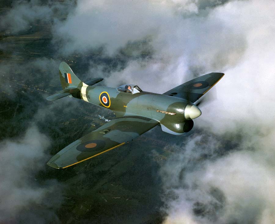 An exceedingly rare color photo of a Tempest in its element, in this case, NV696 with Hawker test pilot Bill Humble in the cockpit. The photo was taken during a pre-delivery test flight from Langley on November 25, 1944. The next day the aircraft was delivered to 20MU Aston Down and later flew with 222 Sqn. (Photo courtesy of RAF Museum, rafmuseumphotos.com)