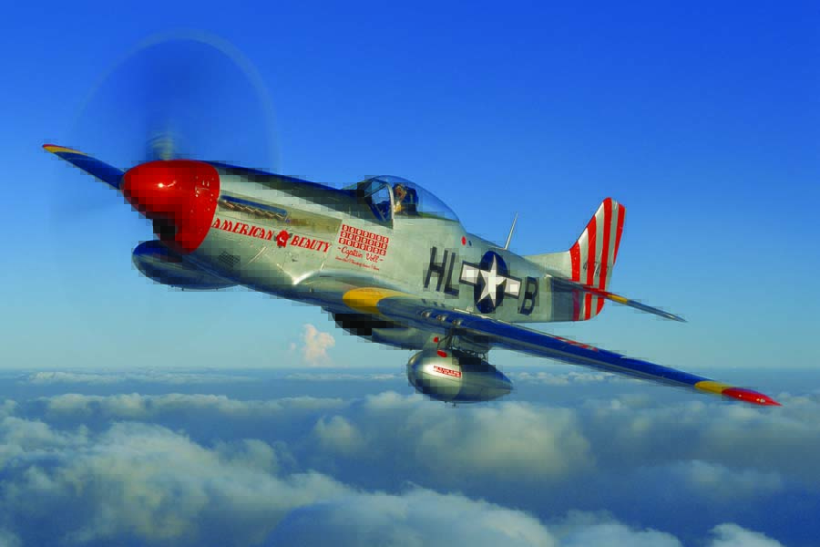 Lee Lauderback, who holds the record for most flying hours in a Mustang, soars above the Kissimmee, Florida clouds in Max Chapman’s Cavalier Aircraft new-build wearing the paint scheme of “American Beauty,” the P-51D flown by Lt. John J. Voll, 31st FG top Mustang ace. (Photo by John Dibbs/Facebook.com/theplanepicture)