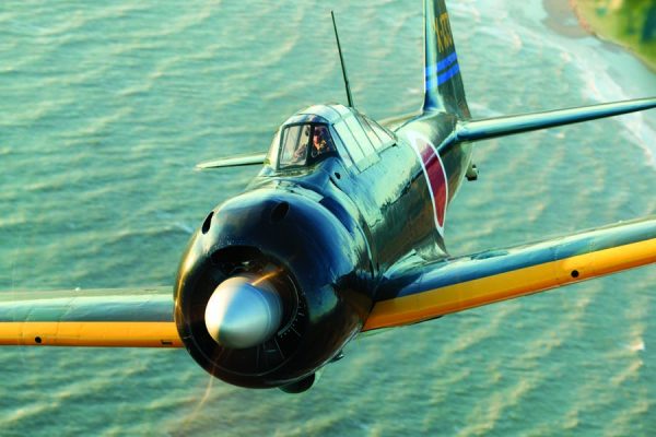 One of the only airworthy Nakajima-built A6M Zeros powered by an original Sakae 21 engine blasts over the beaches of Southern California at sunset for the camera ship. This aircraft was rescued from the jungles of Western New Guinea in remarkable condition near Babo Airfield and later restored in Russia. (Photo by John Dibbs/Facebook.com/theplanepicture)