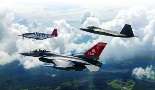 A P-51C from the Commemorative Air Force’s Red Tail Squadron leads a USAF Heritage Flight with an Alabama Air National Guard F-16C from the 100th Fighter Squadron on its left wing and an F-22 from the 325th Fighter Wing at Tyndall AFB on its right wing. (USAF photo)