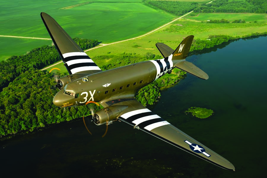 Doug Rozendaal pilots a Douglas C-47 Skytrain owned and operated by the Commemorative Air Force, Central Texas Wing, over the Iowa countryside. Dressed in the scheme of “That’s All, Brother,” the lead aircraft on the D-Day invasion, this C-47 is based out of San Marcos, Texas. (Photo by David Leininger)