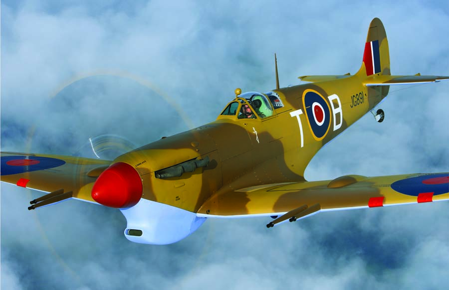 The Spitfire Mk Vc entered service in early 1941, featuring the "universal wing" permitting a variety of armament. Most retained the typical two 20mm cannon and four .303 MGs but some mounted two cannon in each wing. Malta Spits were further modified. Nearly 6,500 were produced into 1943. The prominent chin inlet housed the Vokes carburetor filter for tropical and desert use that reduced top speed by about 10mph and climb rate by 600fpm. (Photo by John Dibbs/planepicture.com)