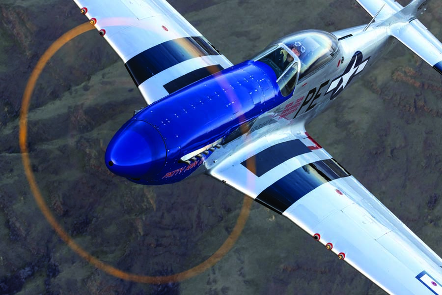 Jared Segebartt pilots the Hangar180 1945 P-51D “Patty Ann II” over the Craig Mountains near Lewiston, Idaho. (Photo by Jim Raeder Aviation hotography)