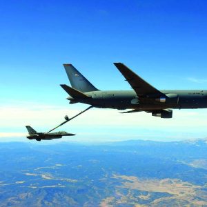 White Sands National Park can be seen in the distance behind a KC-46 Pegasus from the 97th Air Mobility Wing refueling an F-16 Fighting Falcon from the 49th Wing at Holloman Air Force Base. (U.S. Air Force photo)
