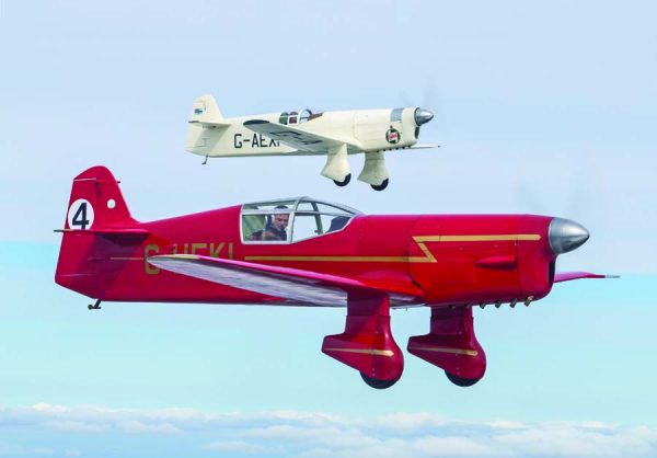 Alex Henshaw’s all –white and only surviving original Mew Gull G-AEXF flying with David Beale’s reproduction G-HEKL near Old Warden, Bedfordshire, United Kingdom. (Photo by Darren Harbar)