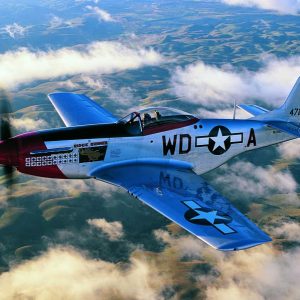 Dan Martin flies over the San Jose, California landscape in his beautifully restored P-51D Mustang “Ridge Runner.” This late war model saw combat with the 356th Fighter Squadron in Europe and is similar to the P-51D flown by ace Col. Joseph Peterburs of the 20th Fighter Group’s 55th Fighter Squadron. This warbird would later compete in the Reno Races “Super Stocker” class and was able to clock lap times in excess of 450mph! (Photo by John Dibbs/Facebook.com/theplanepicturecompany)